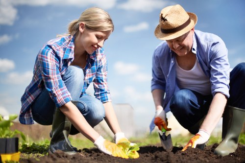 Team member assessing a gardening issue with notes
