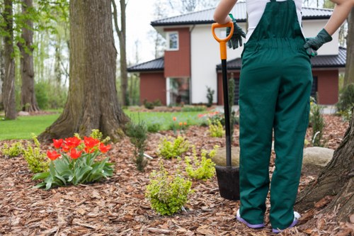 Gardener using protective equipment during maintenance work